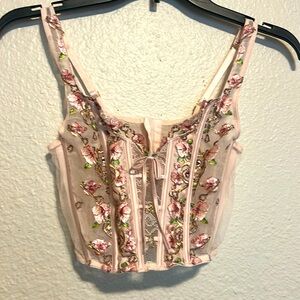 Victoria’s Secret corset with lace and embroidered flowers.